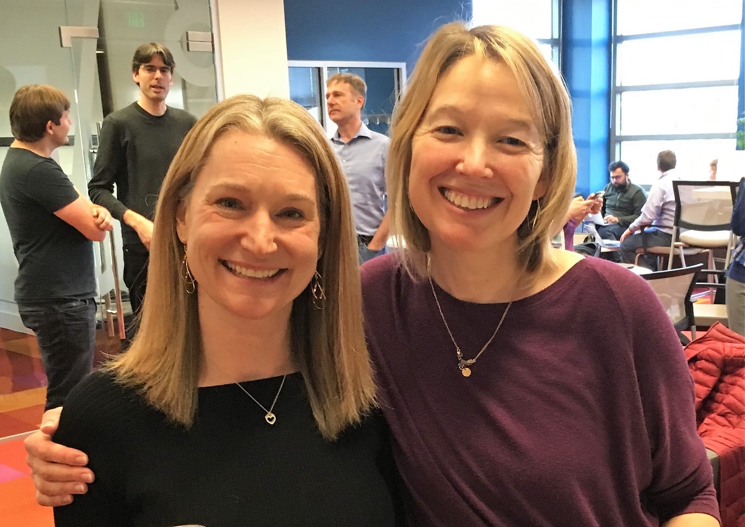 Micaela Parker (left) and Sarah Stone enjoy a gathering at the WRF Data Science Studio. Photo, Robin Brooks